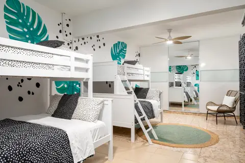 Kids’ bunk room with monstera mural — Casa Paraíso vacation rental in Isabela, Puerto Rico